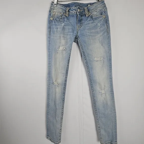 Miss Me factory distressed, rhinestone and embroidered skinny jeans size 27